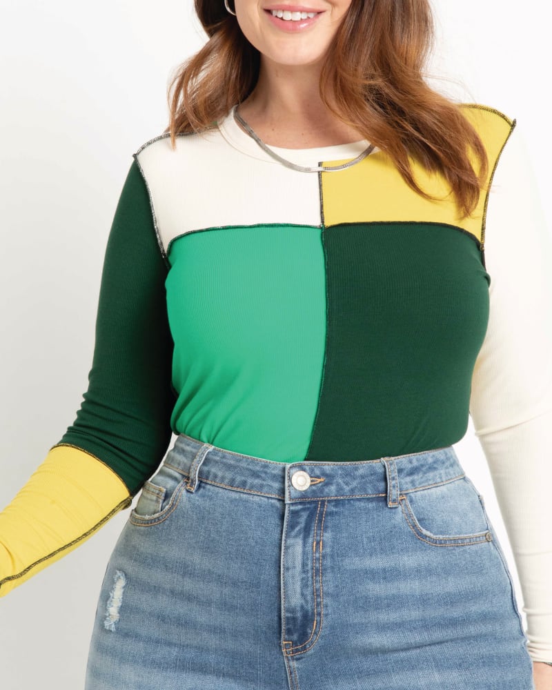 Front of a model wearing a size 14|16 Jimena Patchwork Top in Green And Cream by ELOQUII. | dia_product_style_image_id:196067